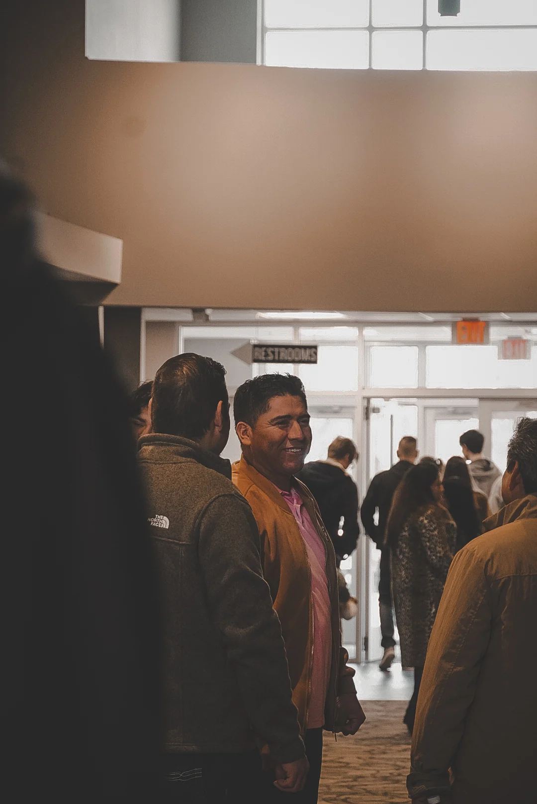 People gathering in the Greater Life Church lobby